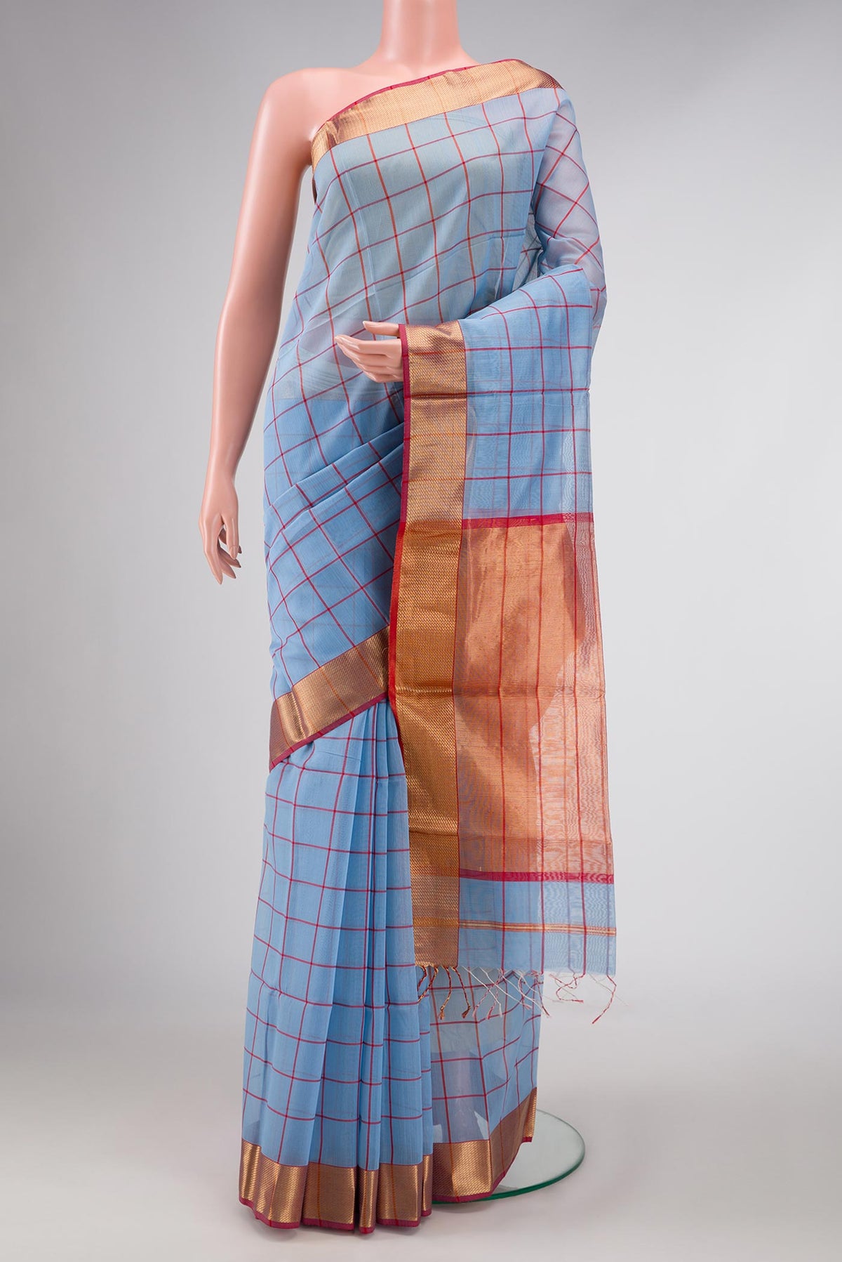 Light Blue Dual Tone Maheshwari Silk Saree with Checked design on the body and Zari Border displayed on a mannequin