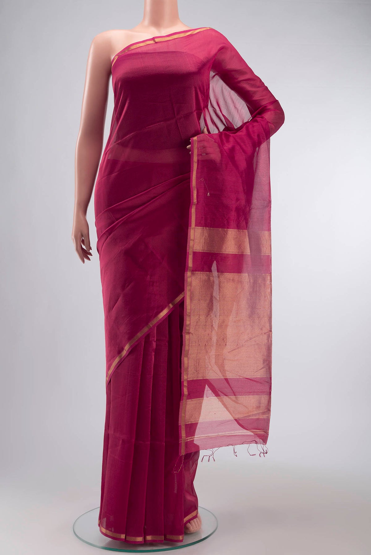 Red Maheshwari Silk Cotton Saree with Stripes on the body and Zari Border displayed on a mannequin