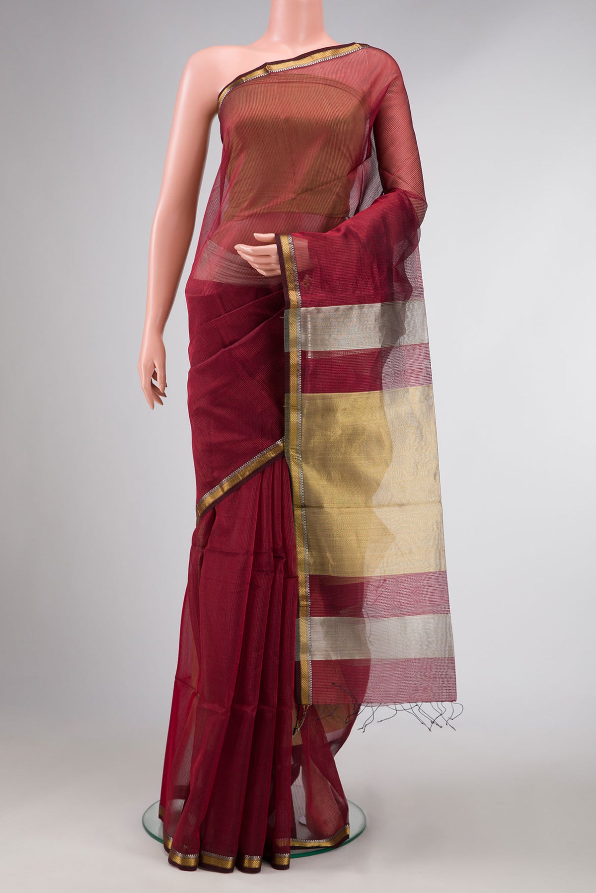 Maroon Dual Tone Maheshwari Silk Saree with Stripes on the body and Zari Border displayed on a mannequin