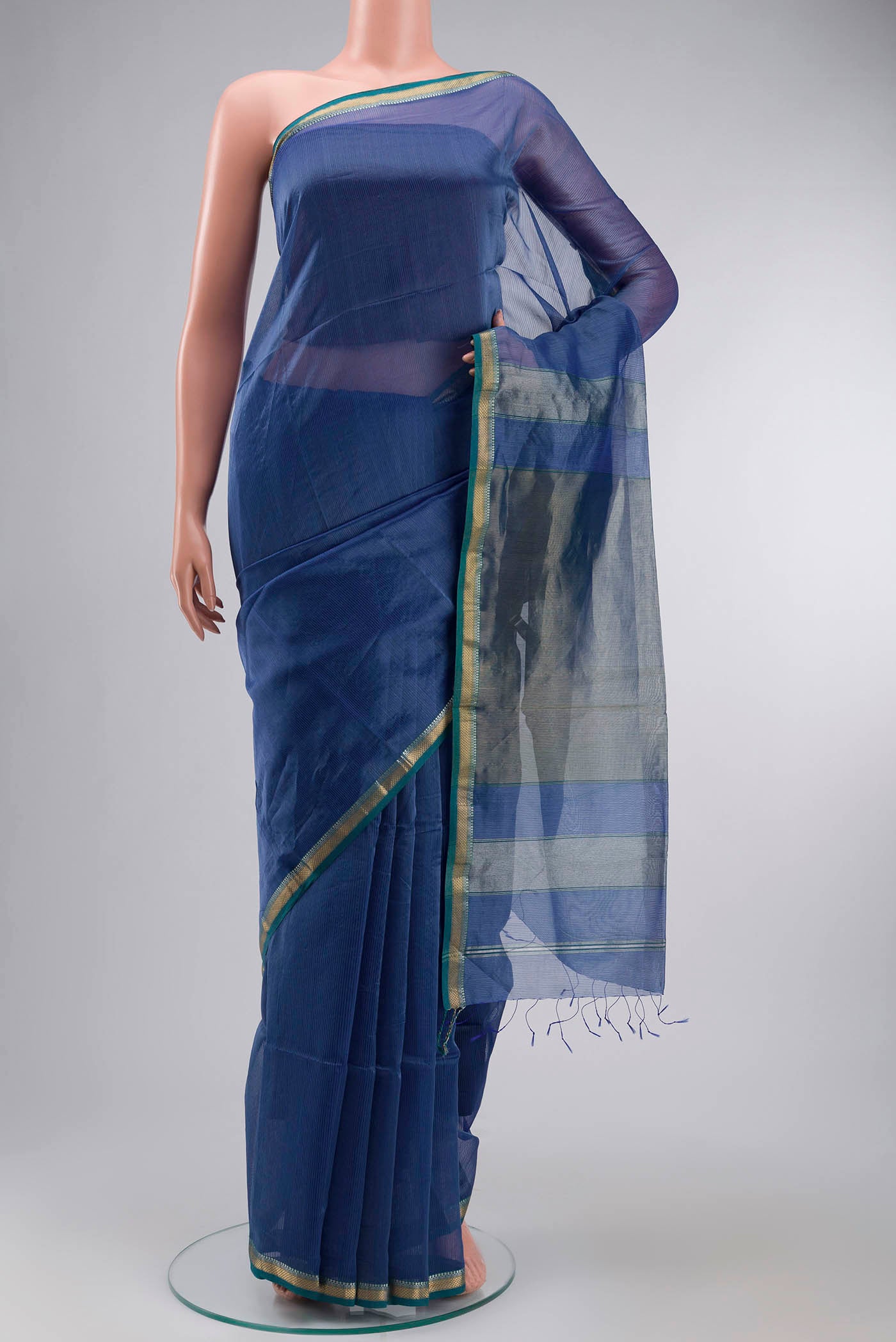 Blue Maheshwari Silk Cotton Saree with Stripes on the body and Zari Border displayed on a mannequin