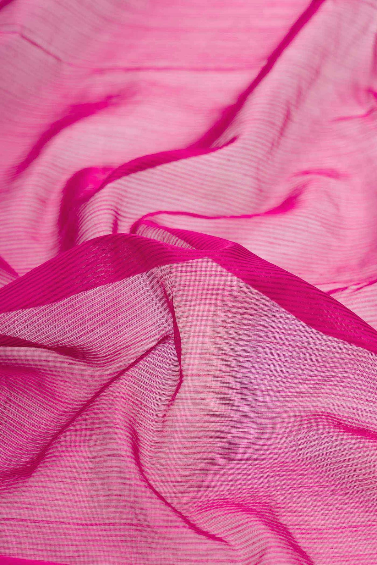 Close up of Pink Dual Tone Silk Cotton Saree with Stripes on the body and Zari Border displaying folds