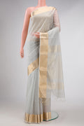 Grey Dual Tone Maheshwari Silk Saree with Checked design on the body and Zari Border displayed on a mannequin