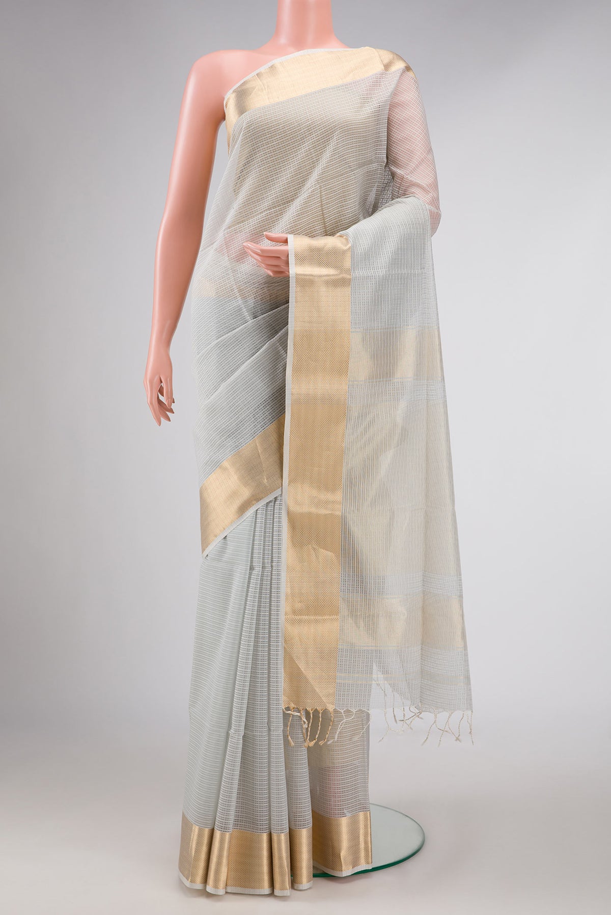 Grey Dual Tone Maheshwari Silk Saree with Checked design on the body and Zari Border displayed on a mannequin