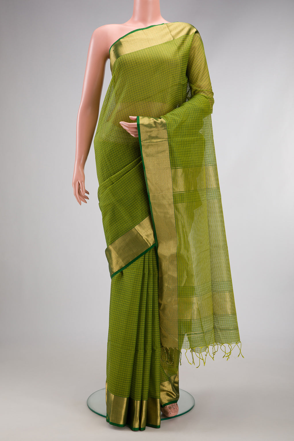 Green Maheshwari Silk Cotton Saree with Stripes on the body and Zari Border.  displayed on a mannequin