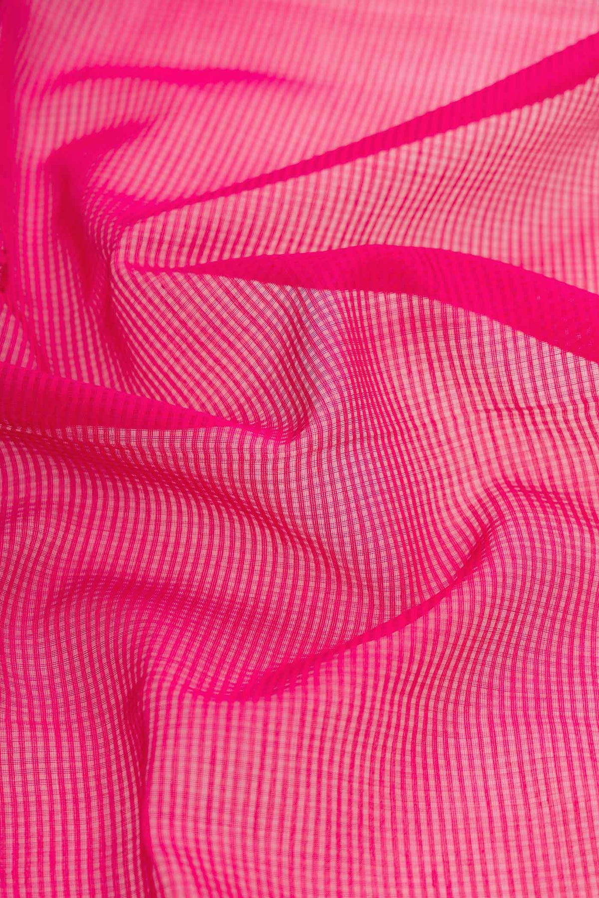 Close up of Pink Dual Tone Maheshwari Silk Saree with Stripes on the body and Zari Border displaying folds
