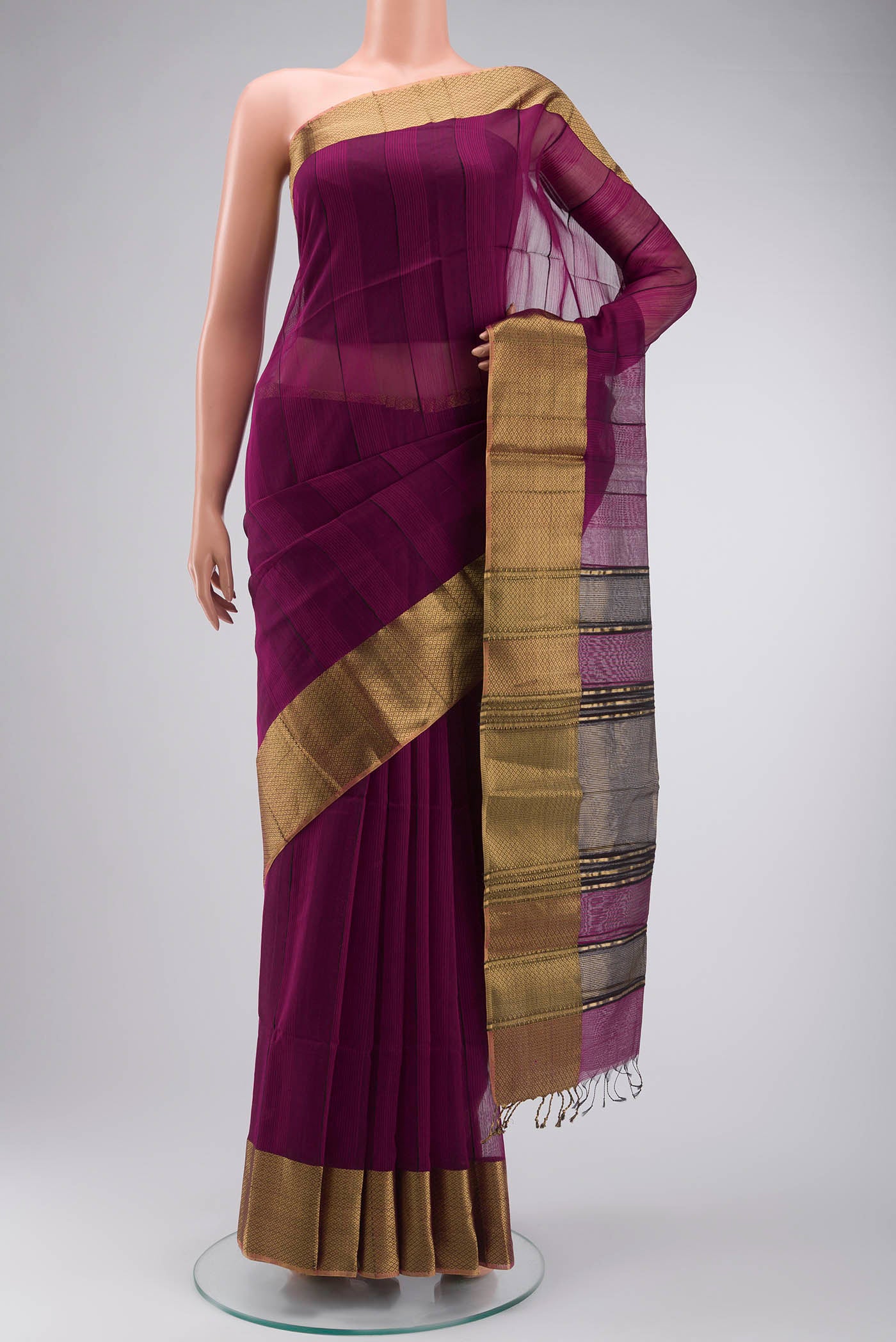 Magenta Maheshwari Silk Cotton Saree with Stripes on the body and Zari Border displayed on a mannequin
