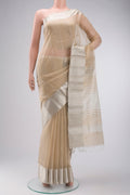 Beige Maheshwari Silk Cotton Saree with Stripes on the body and Zari Border displayed on a mannequin