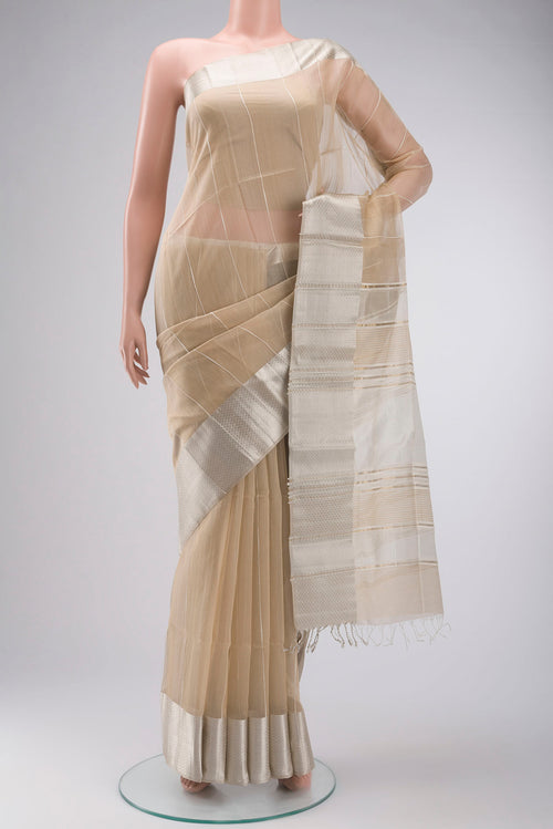 Beige Maheshwari Silk Cotton Saree with Stripes on the body and Zari Border displayed on a mannequin