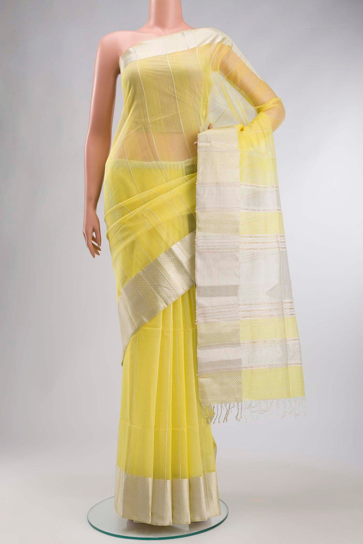 Yellow Maheshwari Silk Cotton Saree with Stripes on the body and Zari Border displayed on a mannequin