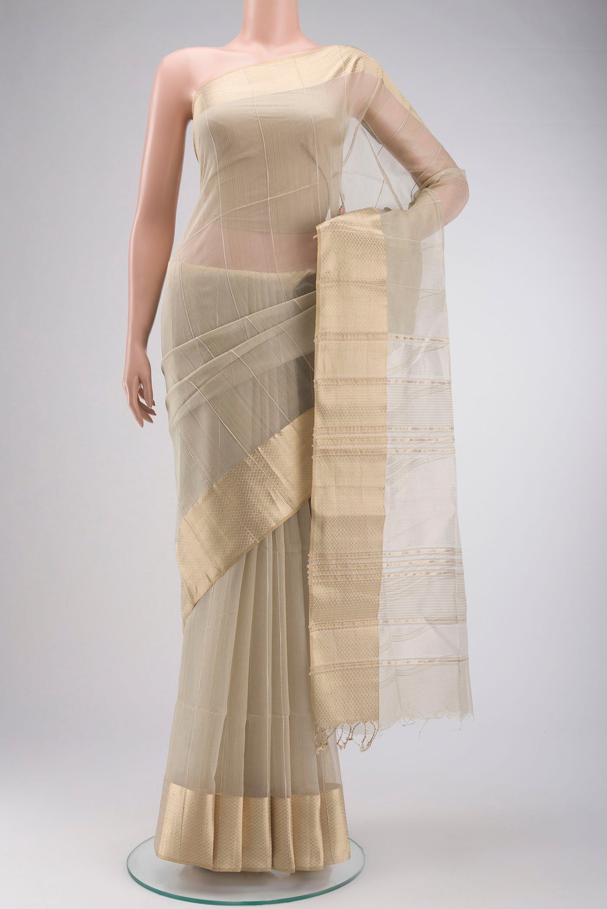 Beige Maheshwari Silk Cotton Saree with Stripes on the body and Zari Border displayed on a mannequin