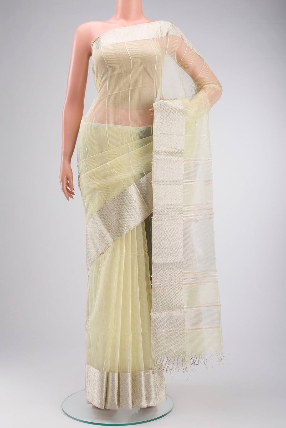 Yellow Maheshwari Silk Cotton Saree with Stripes on the body and Zari Border displayed on a mannequin