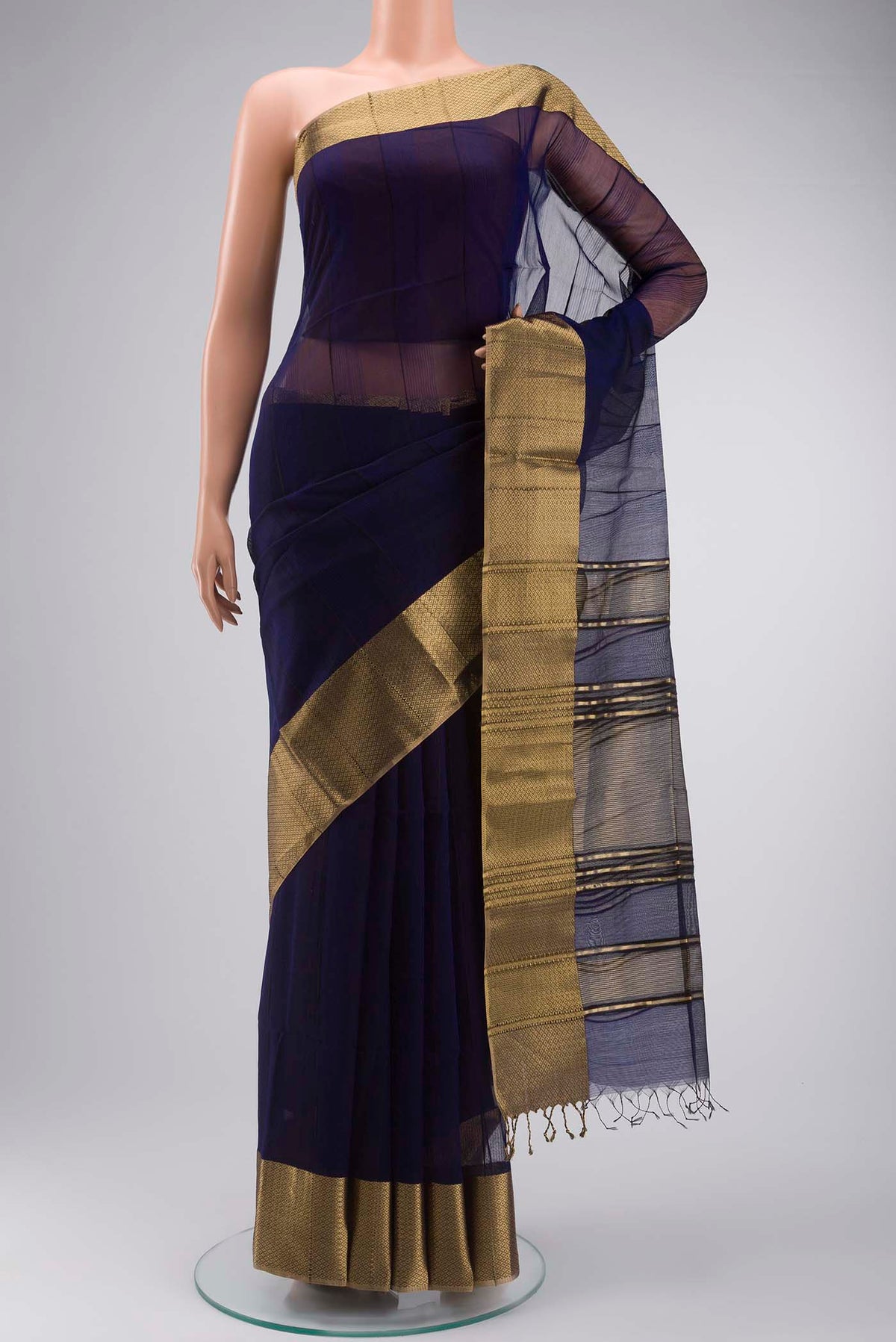 Navy Blue Maheshwari Silk Cotton Saree with Stripes on the body and Zari Border displayed on a mannequin