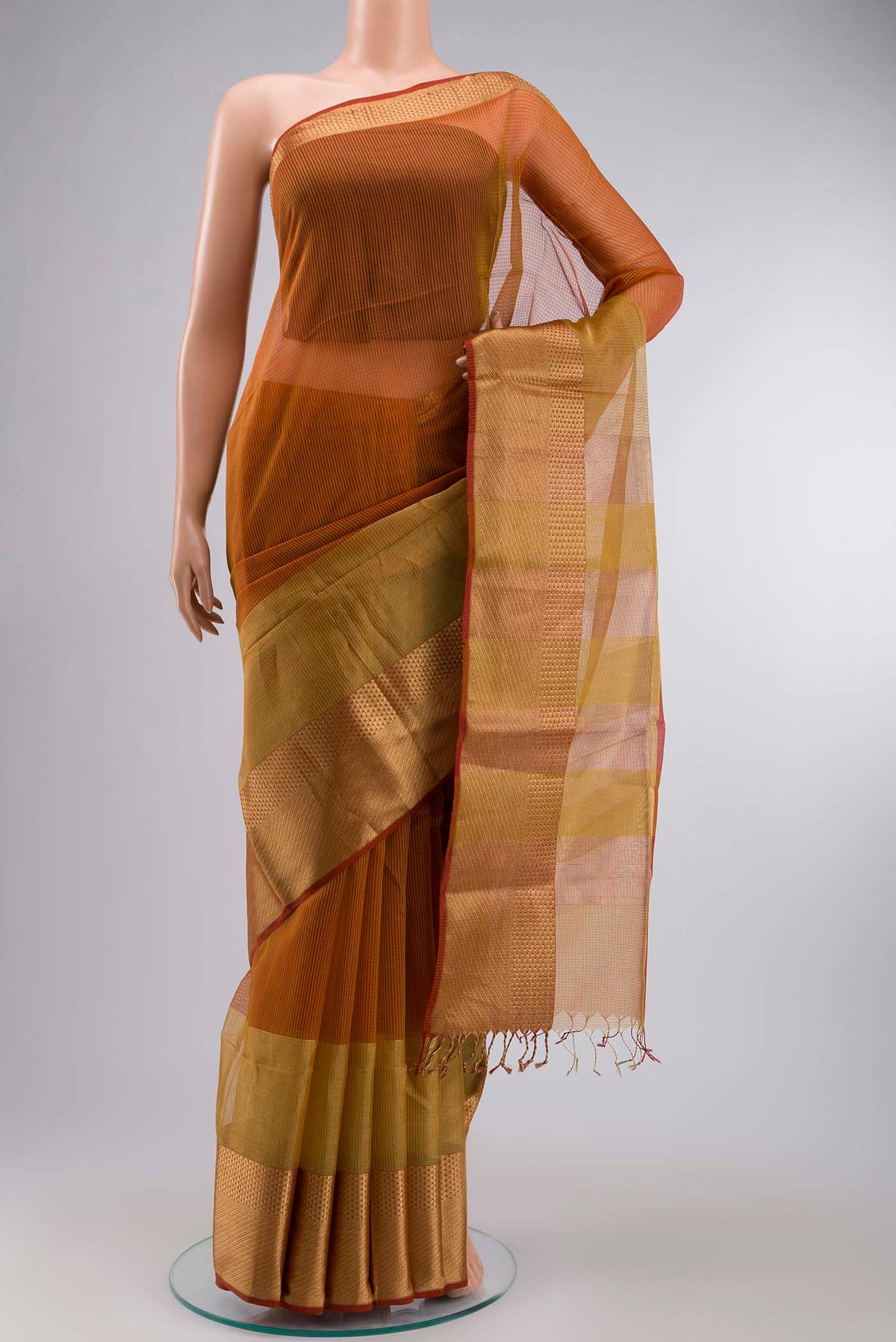 Multi Color Maheshwari Silk Cotton Saree with Stripes on the body and Zari Border displayed on a mannequin