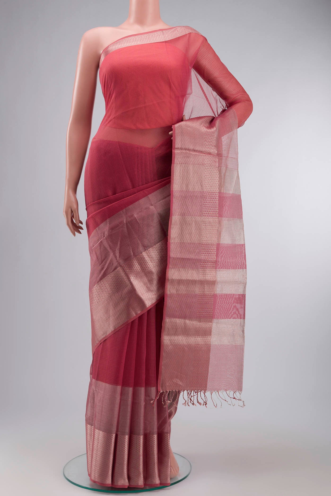 Pink Maheshwari Silk Cotton Saree with Checked design on the body and Zari Border displayed on a mannequin