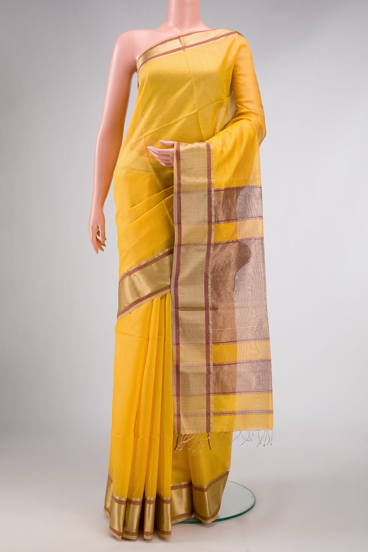 Yellow Dual Tone Maheshwari Silk Saree with Checked design on the body and Zari Border displayed on a mannequin