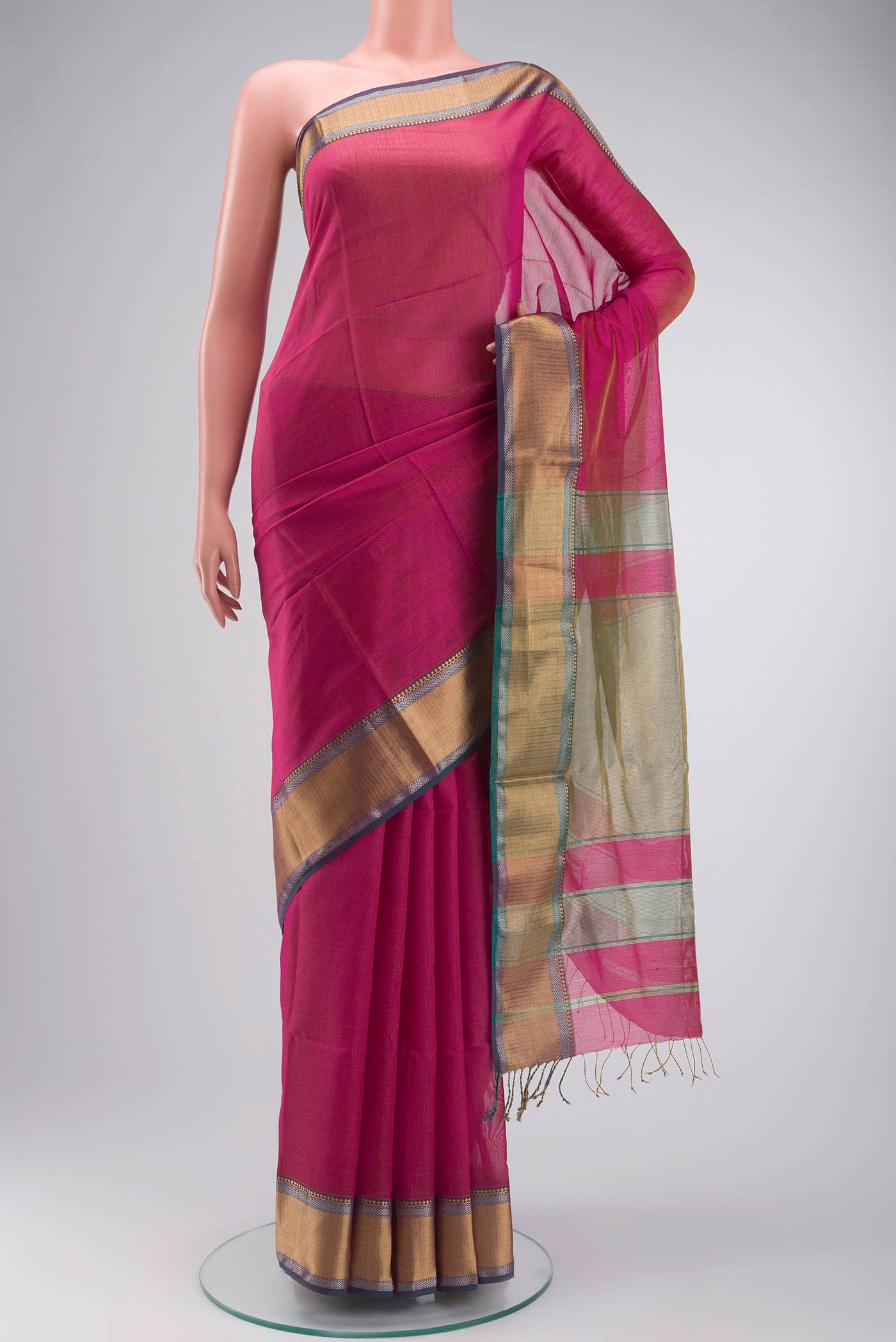 Pink Maheshwari Silk Cotton Saree with Checked design on the body and Zari Border displayed on a mannequin