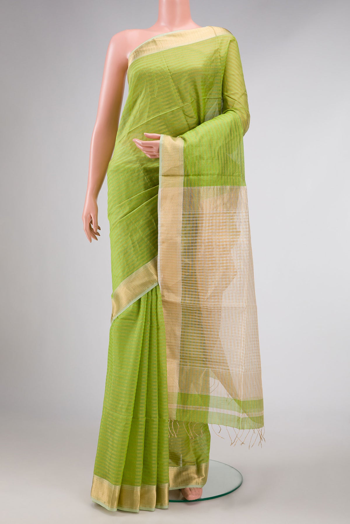 Parrot Green Dual Tone Maheshwari Silk Saree with Checked design on the body and Zari Border displayed on a mannequin