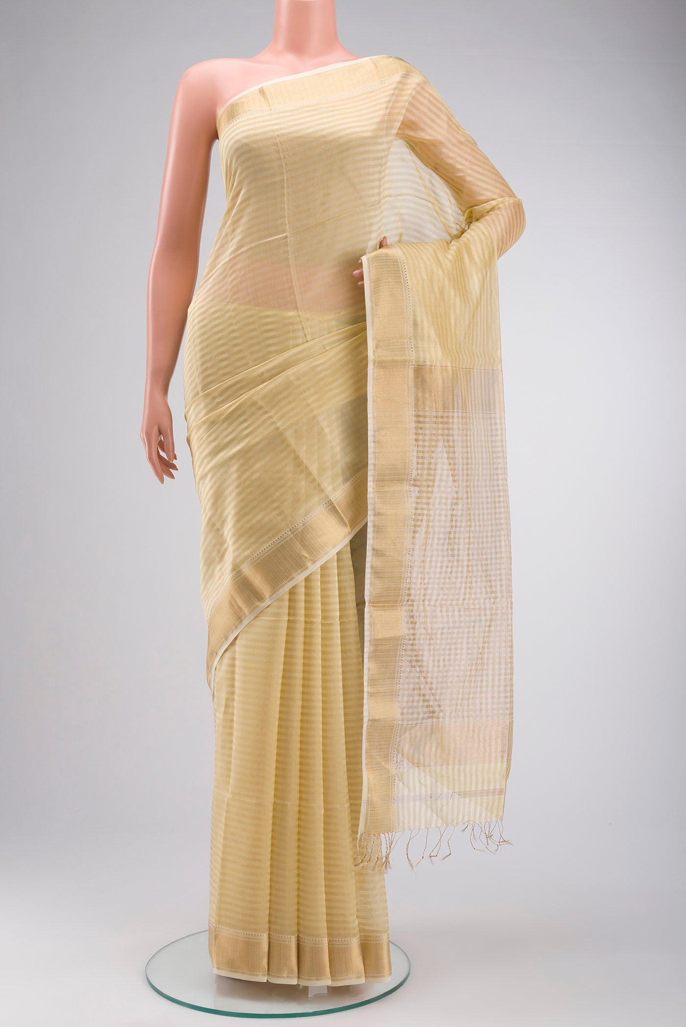 Cream Banarasi Raw Silk Saree with Stripes on the body and Zari Border displayed on a mannequin