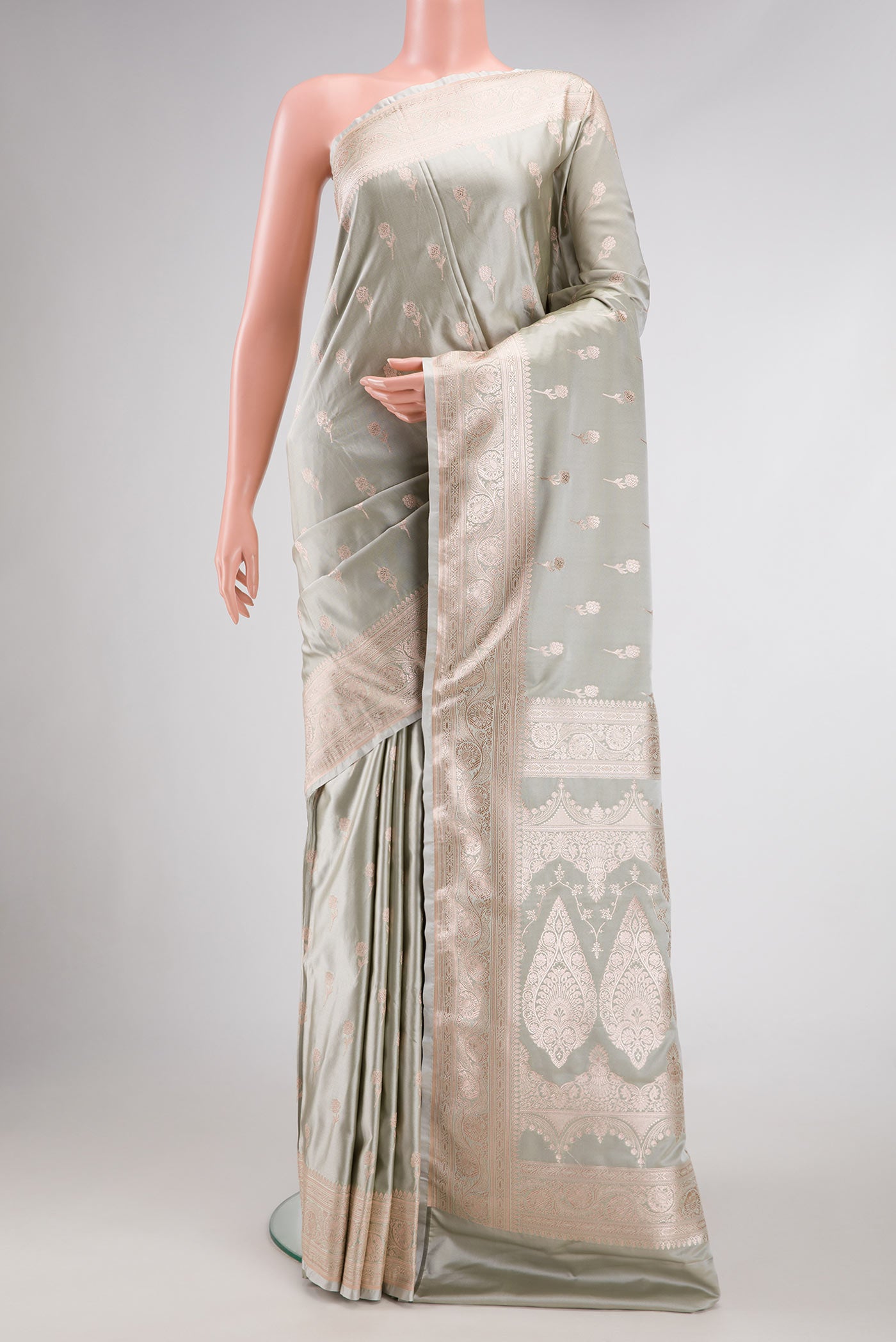 Grey Dual Tone Blended Banarasi Silk Saree with Zari Butta on the body and Zari Border.  displayed on a mannequin