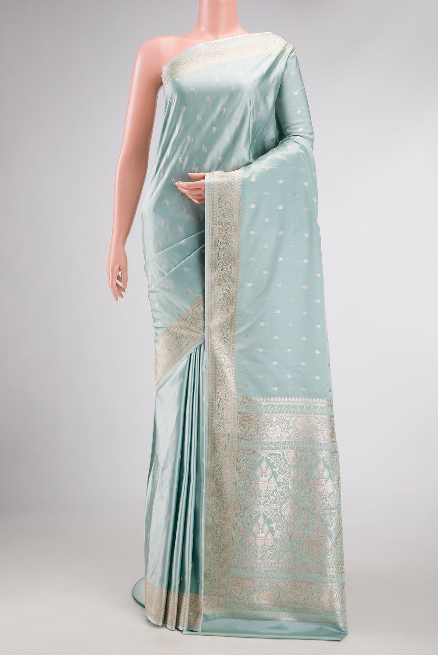 Light Green Dual Tone Blended Banarasi Silk Saree with Zari Butta on the body and Zari Border.  displayed on a mannequin