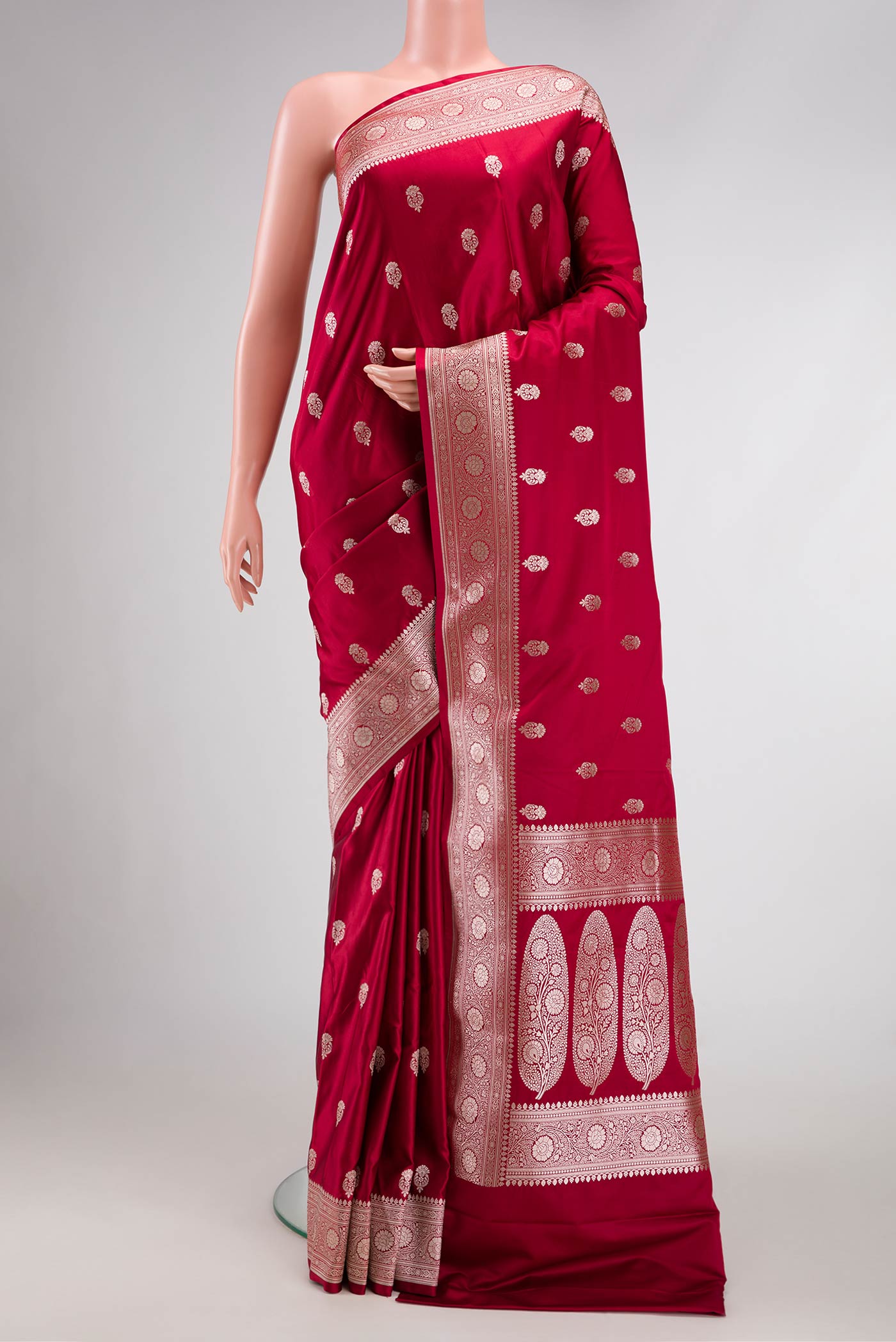 Maroon Dual Tone Blended Banarasi Silk Saree with Zari Butta on the body and Zari Border.  displayed on a mannequin