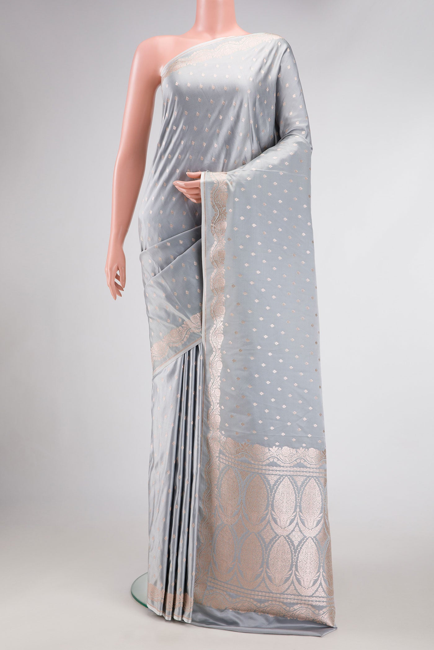 Grey Dual Tone Blended Banarasi Silk Saree with Zari Butta on the body and Zari Border.  displayed on a mannequin