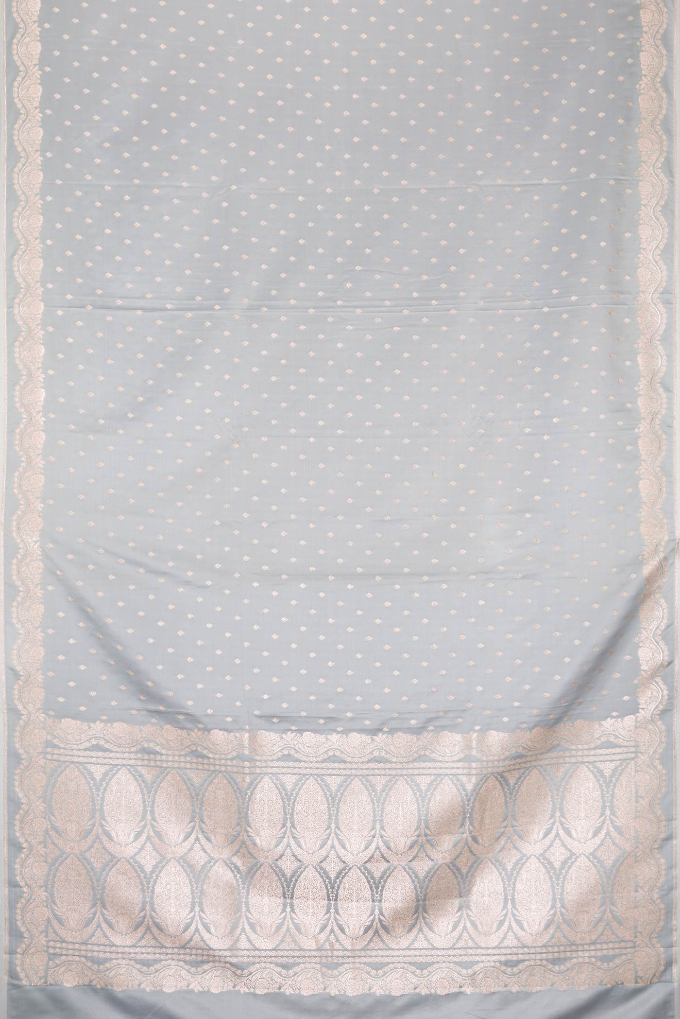 Flat view of Grey Dual Tone Blended Banarasi Silk Saree with Zari Butta on the body and Zari Border. 