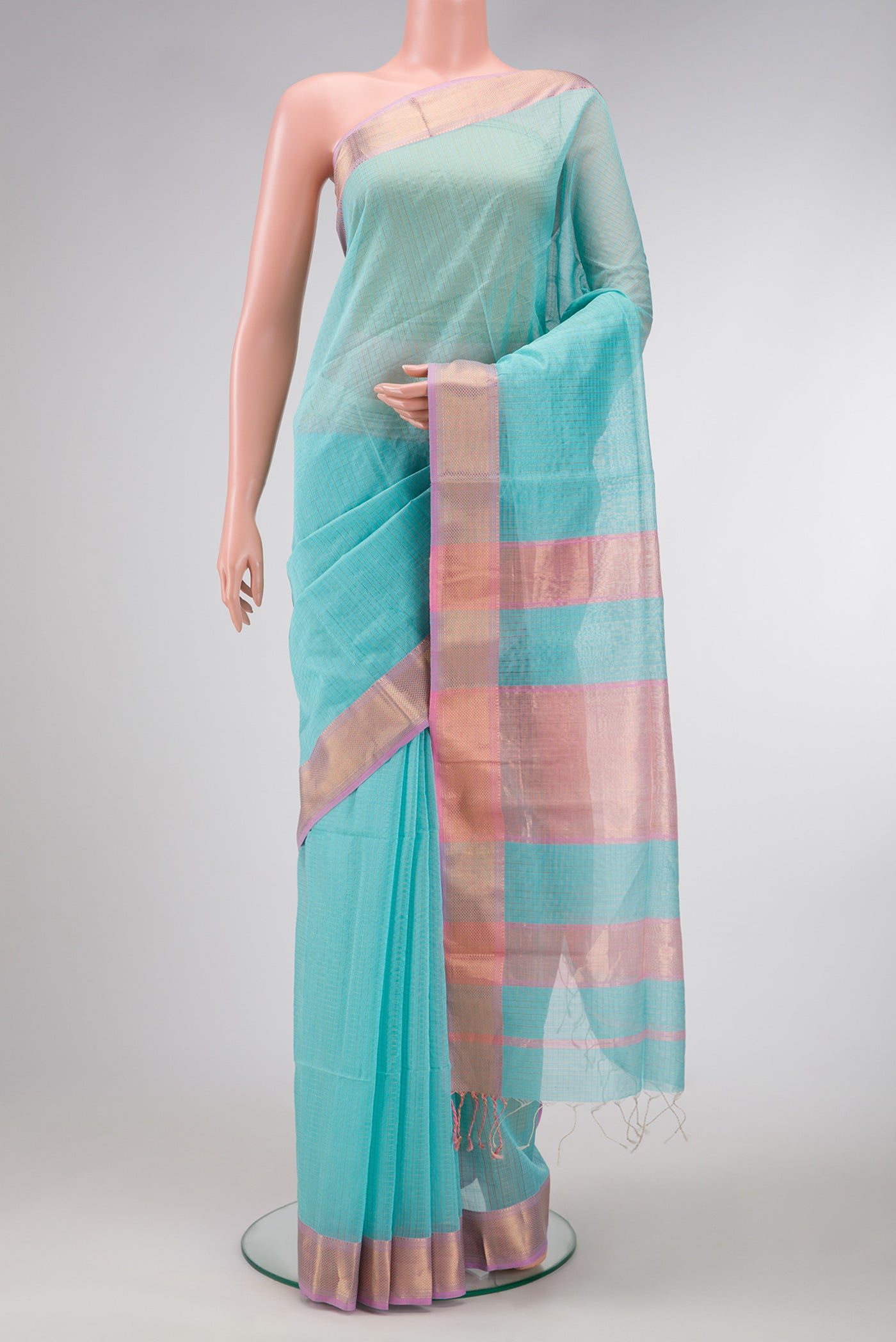 Sky Blue Dual Tone Maheshwari Silk Saree with Checked design on the body and Zari Border.  displayed on a mannequin