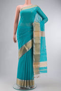 Blue Maheshwari Silk Cotton Saree with Zari Butta on the body and Zari Border displayed on a mannequin