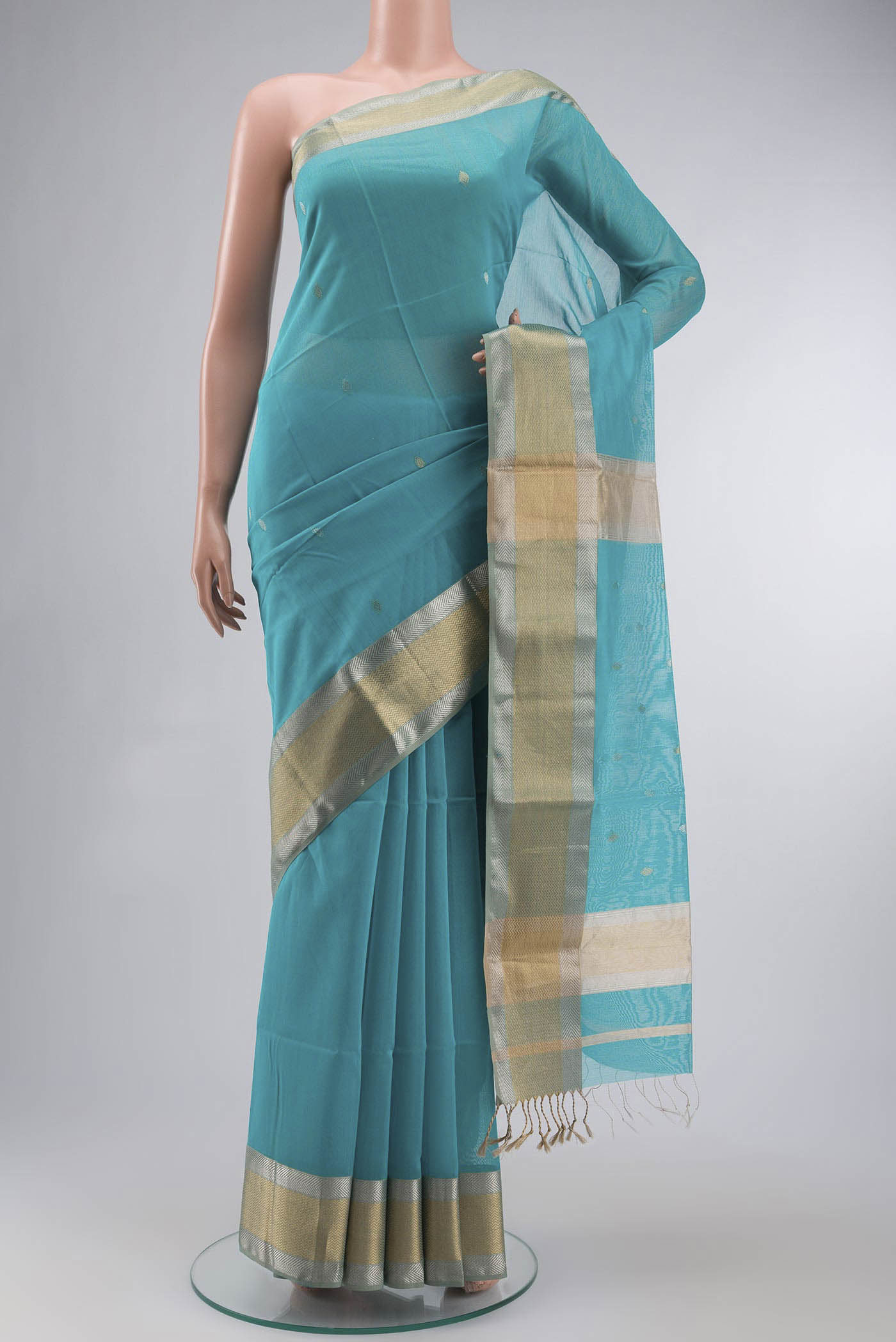 Blue Maheshwari Silk Cotton Saree with Zari Butta on the body and Zari Border displayed on a mannequin