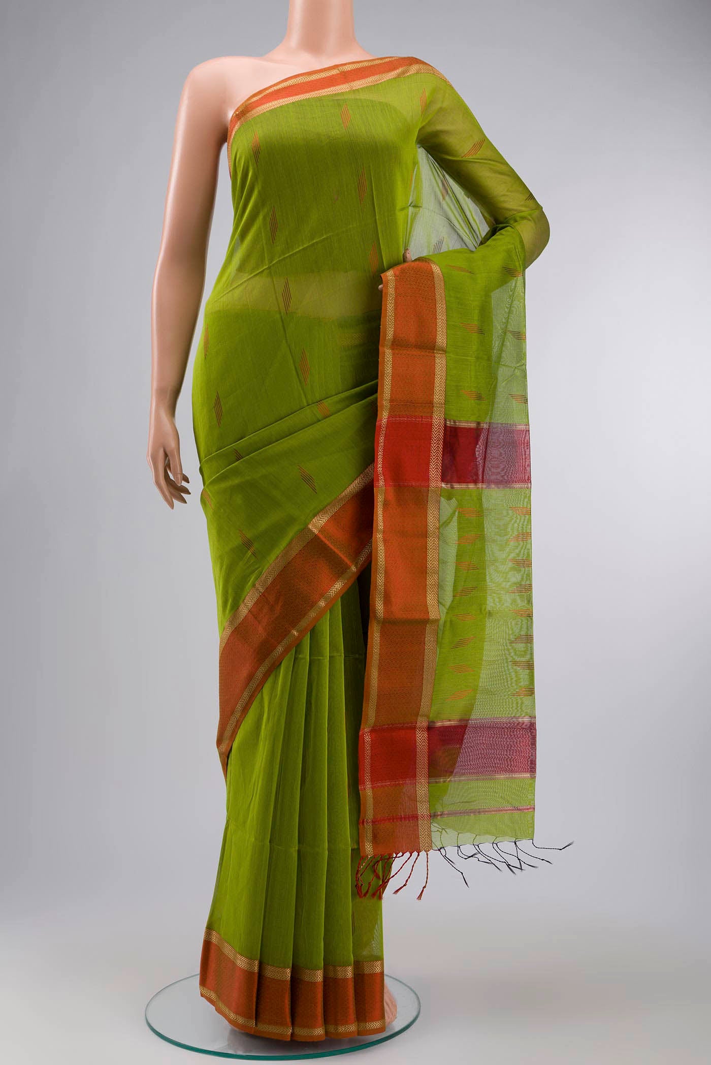 Green Maheshwari Silk Cotton Saree with Stripes on the body and Zari Border displayed on a mannequin