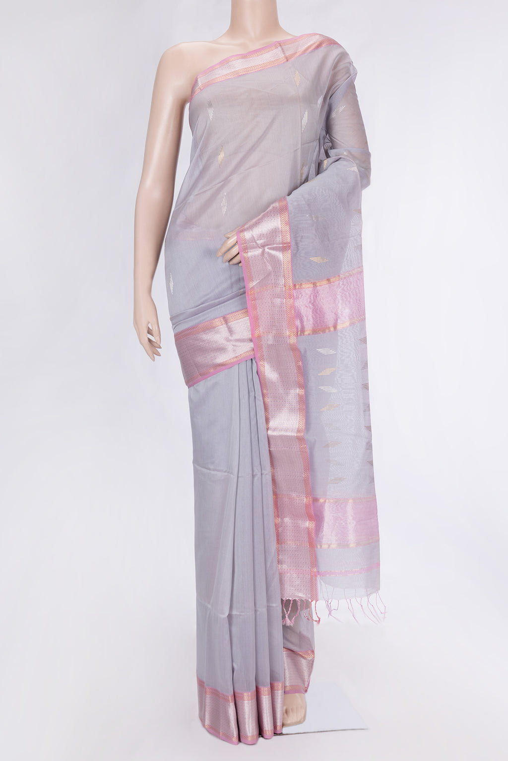 Grey Dual Tone Maheshwari Silk Saree with Zari Butta on the body and Zari Border.  displayed on a mannequin