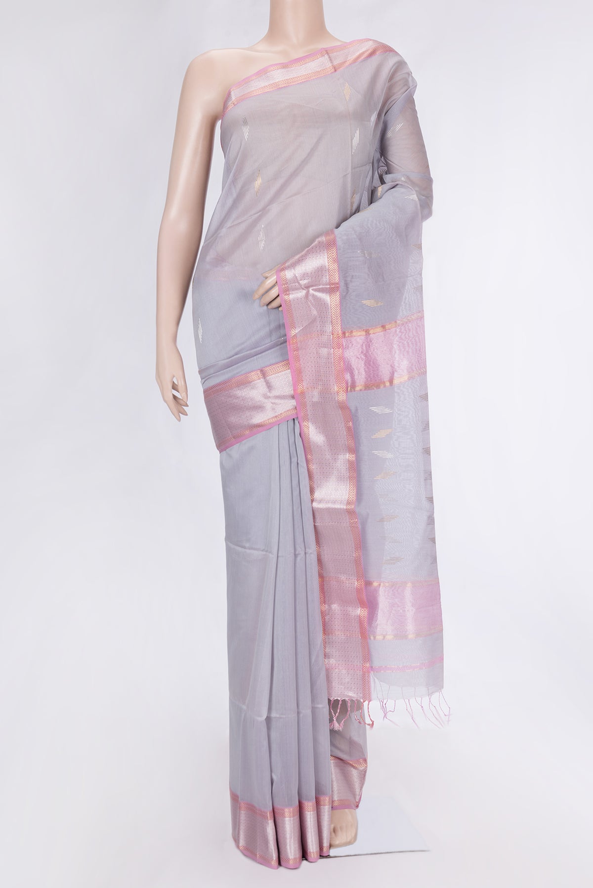 Grey Dual Tone Maheshwari Silk Saree with Zari Butta on the body and Zari Border.  displayed on a mannequin