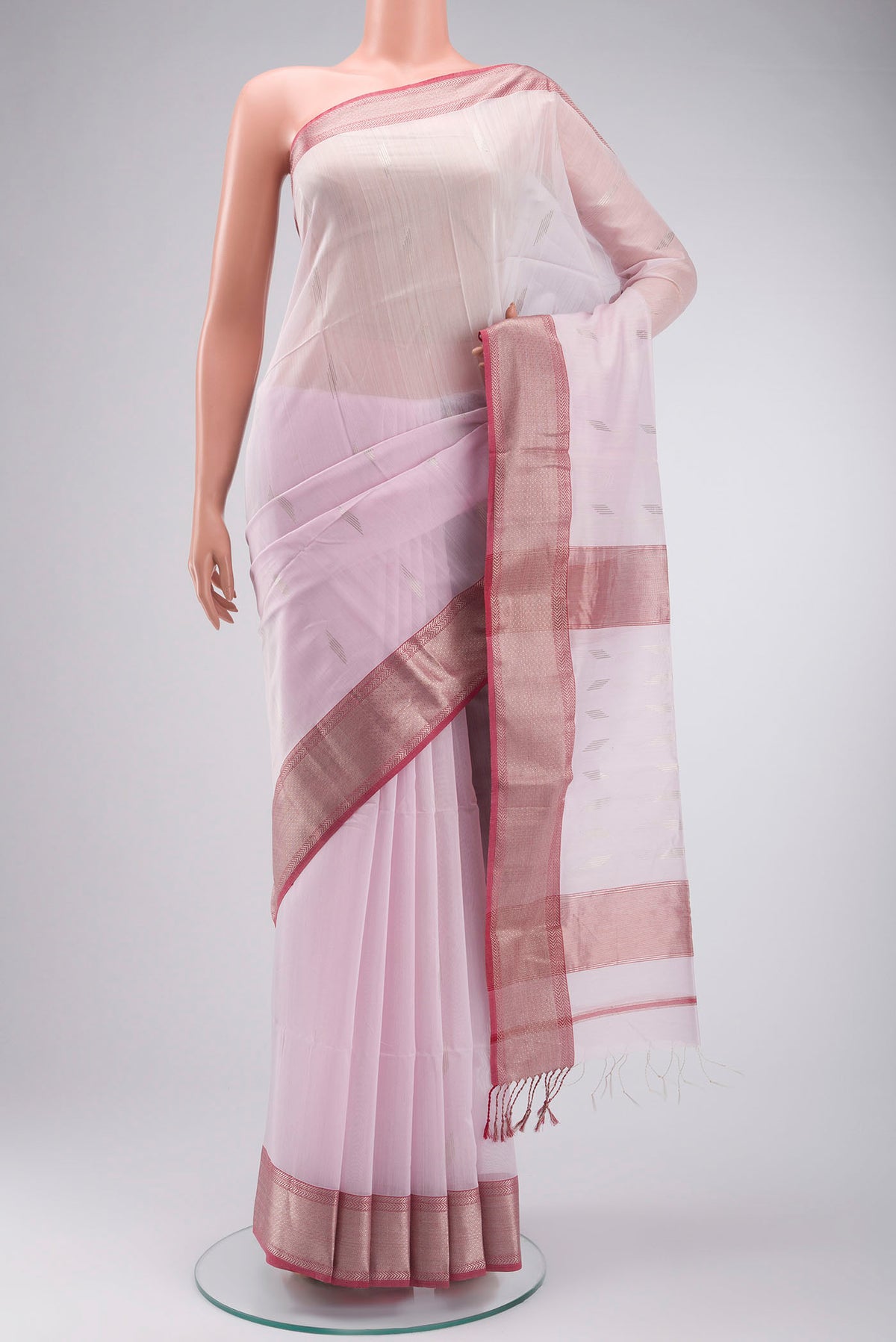 Rose pink Maheshwari Silk Cotton Saree with Zari Butta on the body and Zari Border displayed on a mannequin