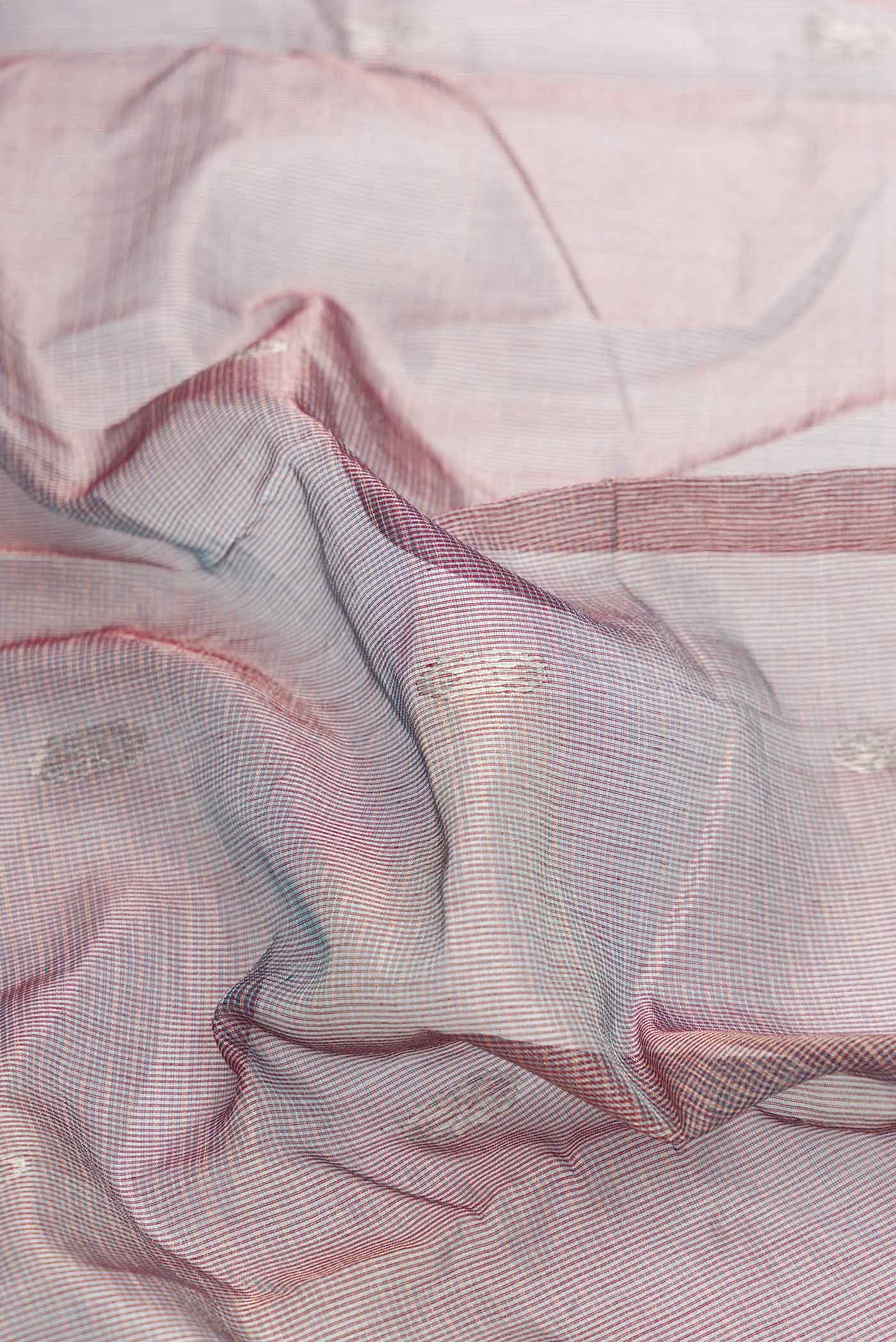 Close up of Grey Dual Tone Kota Silk Saree with Zari Butta on the body and Zari Border displaying folds