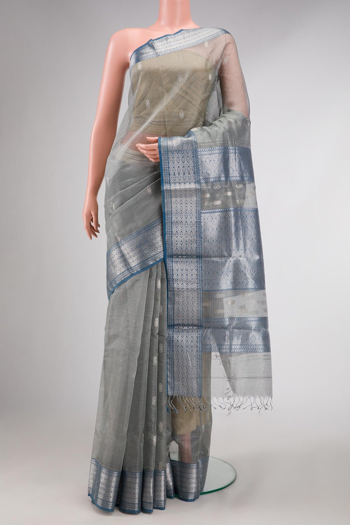 Grey Dual Tone Kota Silk Saree with Zari Butta on the body and Zari Border displayed on a mannequin