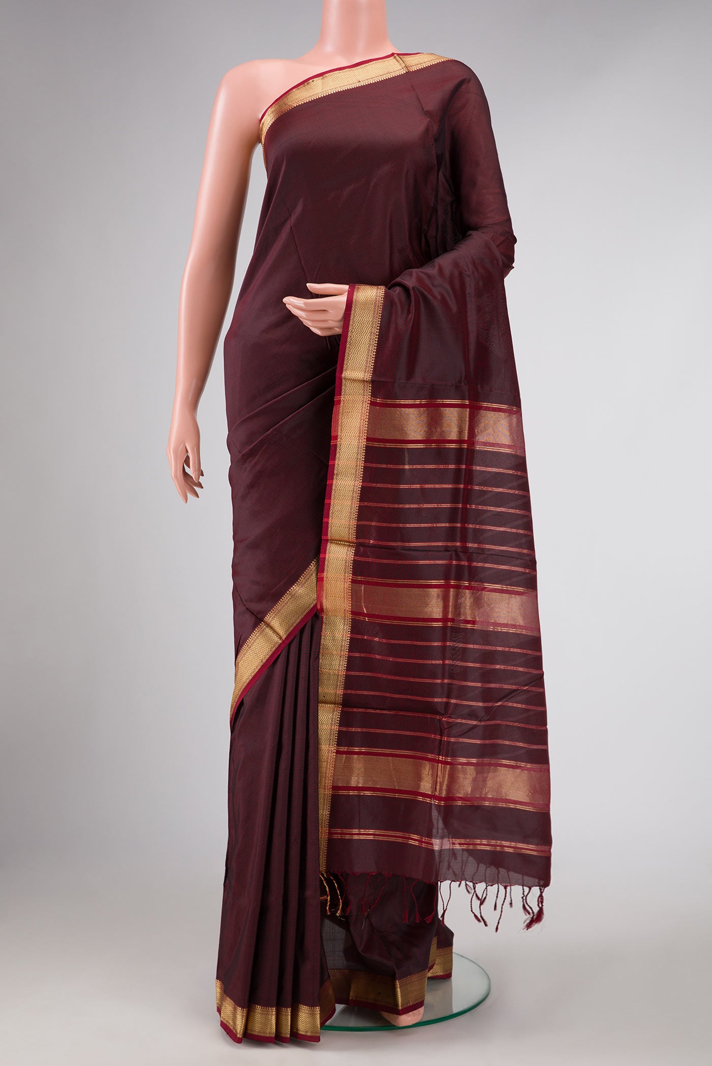 Brown Dual Tone Maheshwari Silk Saree with Stripes on the body and Zari Border displayed on a mannequin