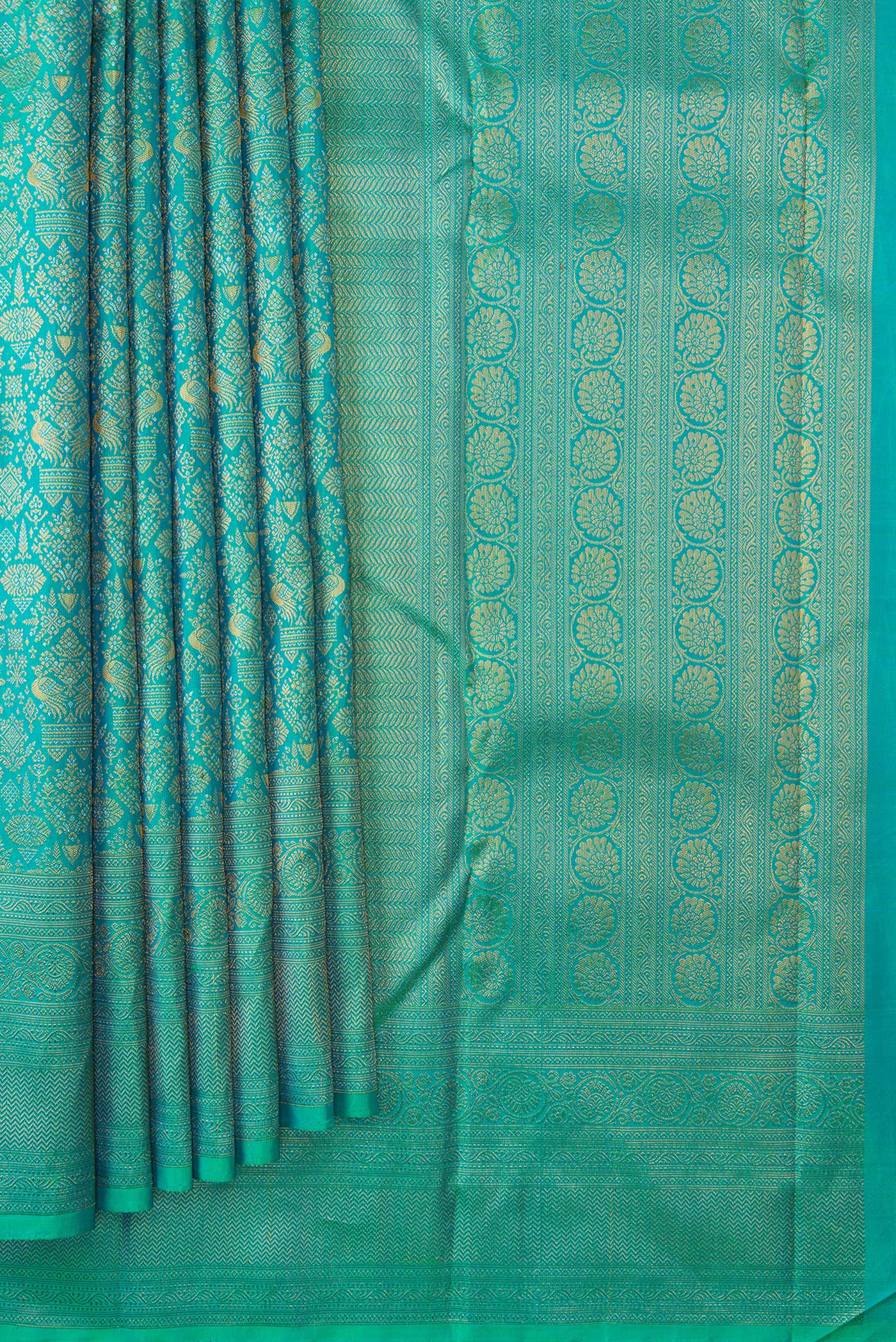Pleats and pallu of Sea Green Dual Tone Kanchipuram Silk Saree with Zari Brocade on the body and Fancy Border. 