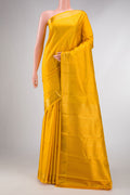 Yellow Dual Tone Kanchipuram Silk Saree with Zari Butta on the body and Zari Border displayed on a mannequin