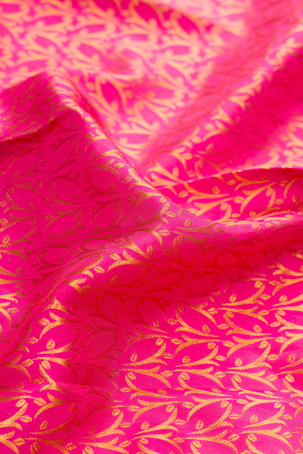 Close up of Pink Dual Tone Kanchipuram Silk Saree with Zari Brocade on the body and Zari Border.  displaying folds