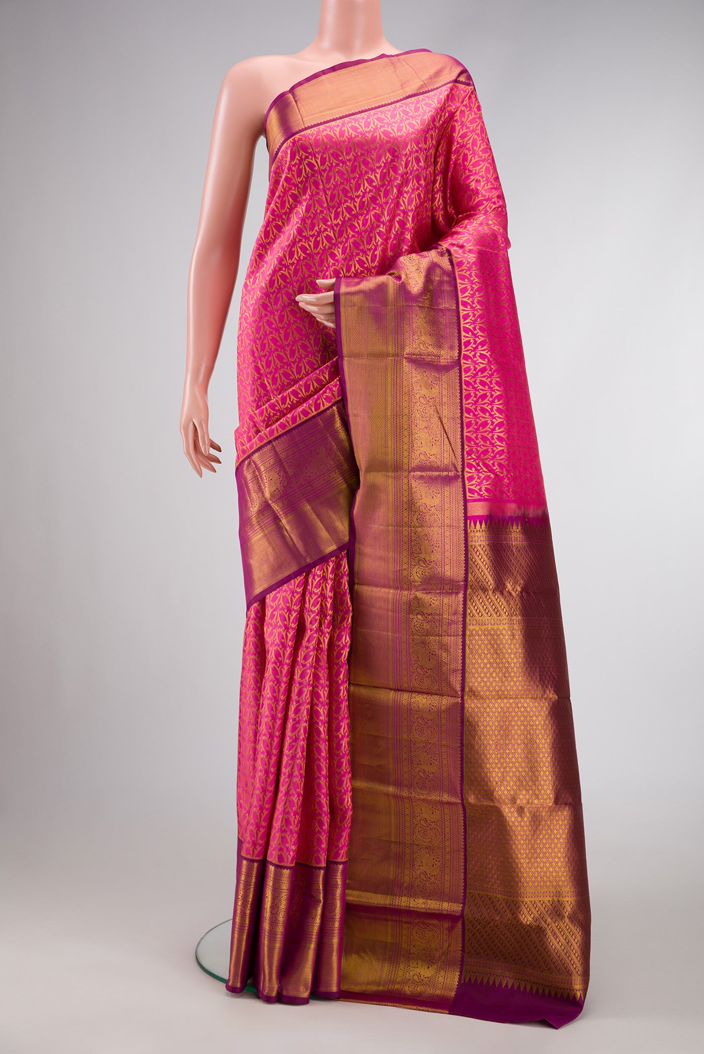 Pink Dual Tone Kanchipuram Silk Saree with Zari Brocade on the body and Zari Border.  displayed on a mannequin