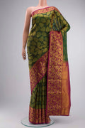Green Kanchipuram Silk Saree with Zari Butta on the body and Zari Border displayed on a mannequin