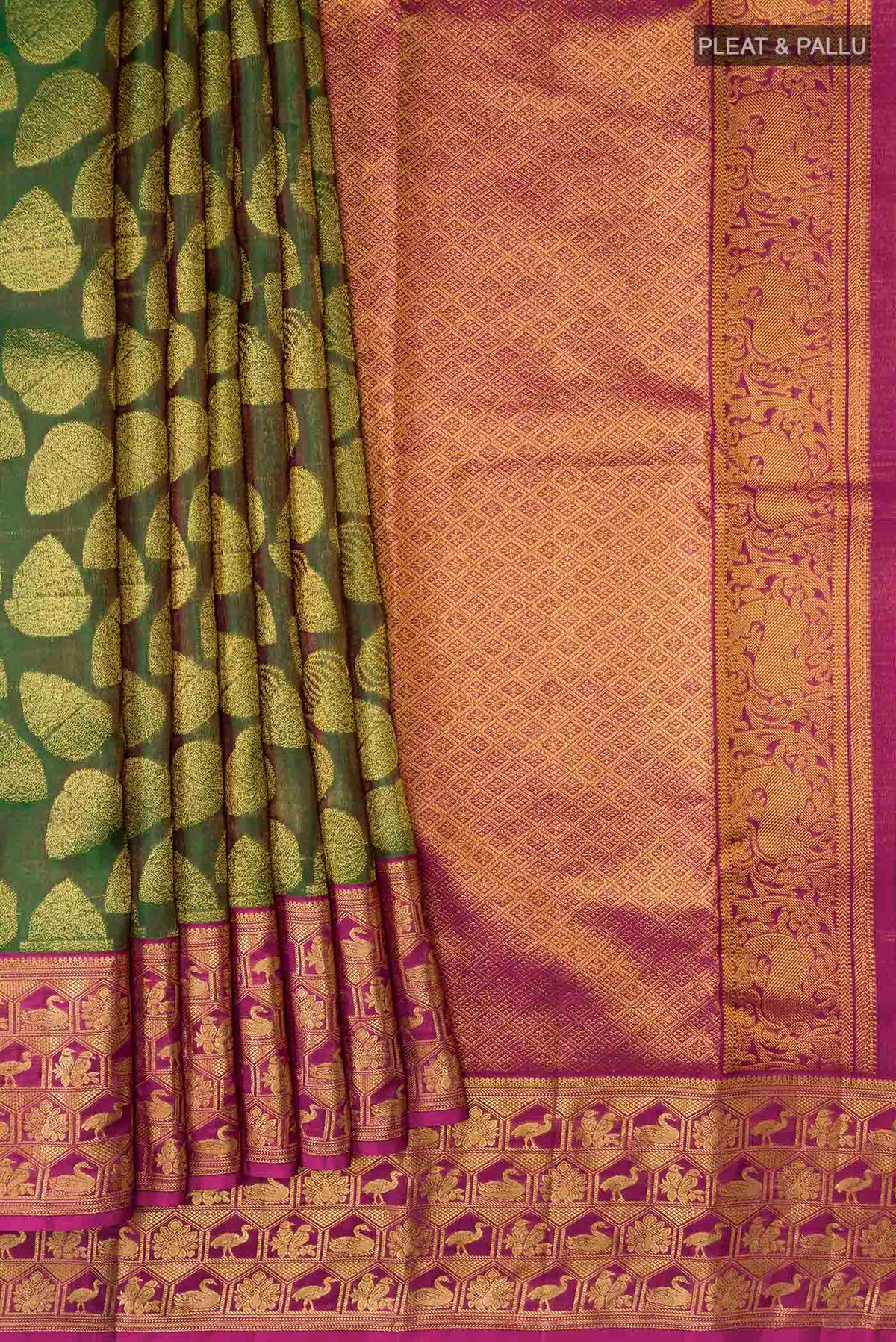 Pleats and pallu of Green Kanchipuram Silk Saree with Zari Butta on the body and Zari Border