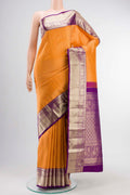 Orange Kanchipuram Silk Saree with Stripes on the body and Zari Border displayed on a mannequin