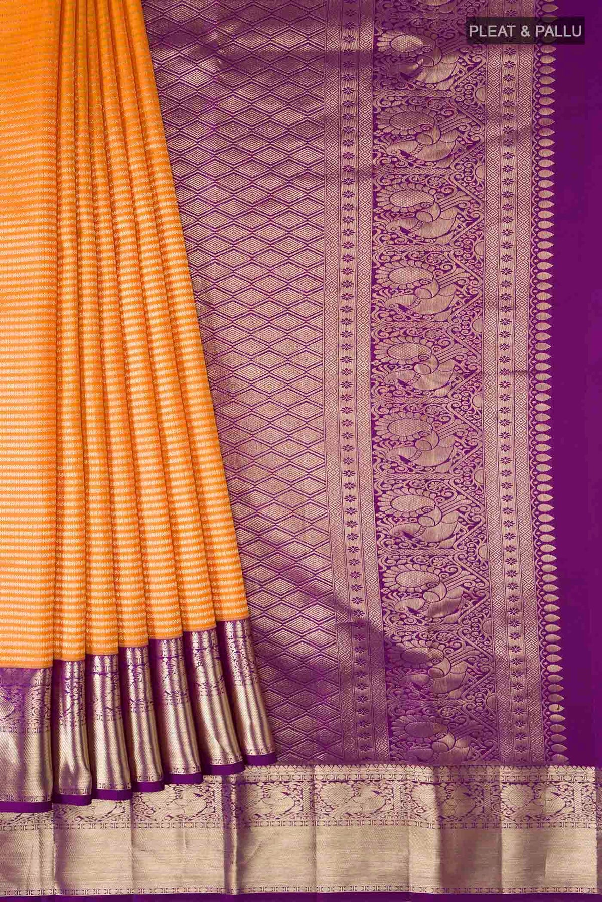 Pleats and pallu of Orange Kanchipuram Silk Saree with Stripes on the body and Zari Border