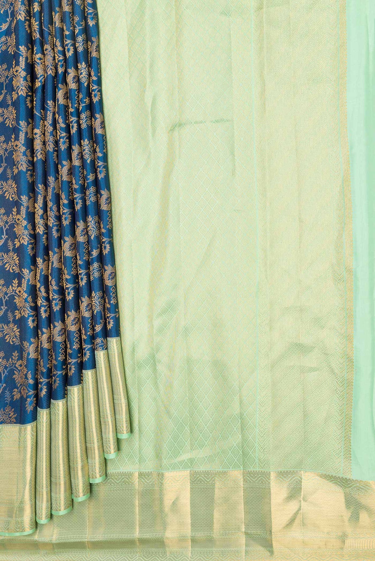 Pleats and pallu of Peacock Blue Dual Tone Kanchipuram Saree with Zari Brocade on the body and Zari Border