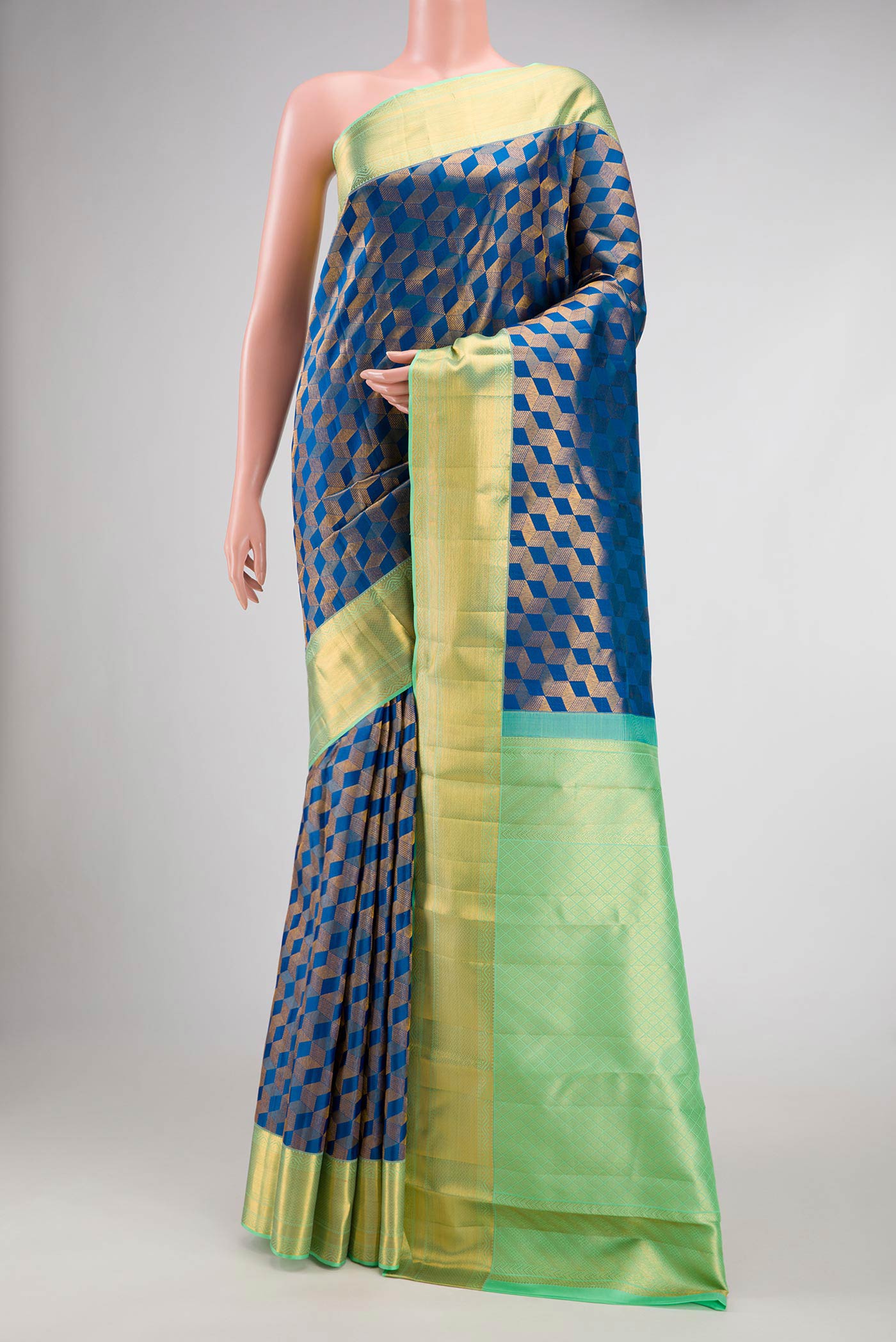 Peacock Blue Dual Tone Kanchipuram Silk Saree with Zari Brocade on the body and Zari Border.  displayed on a mannequin