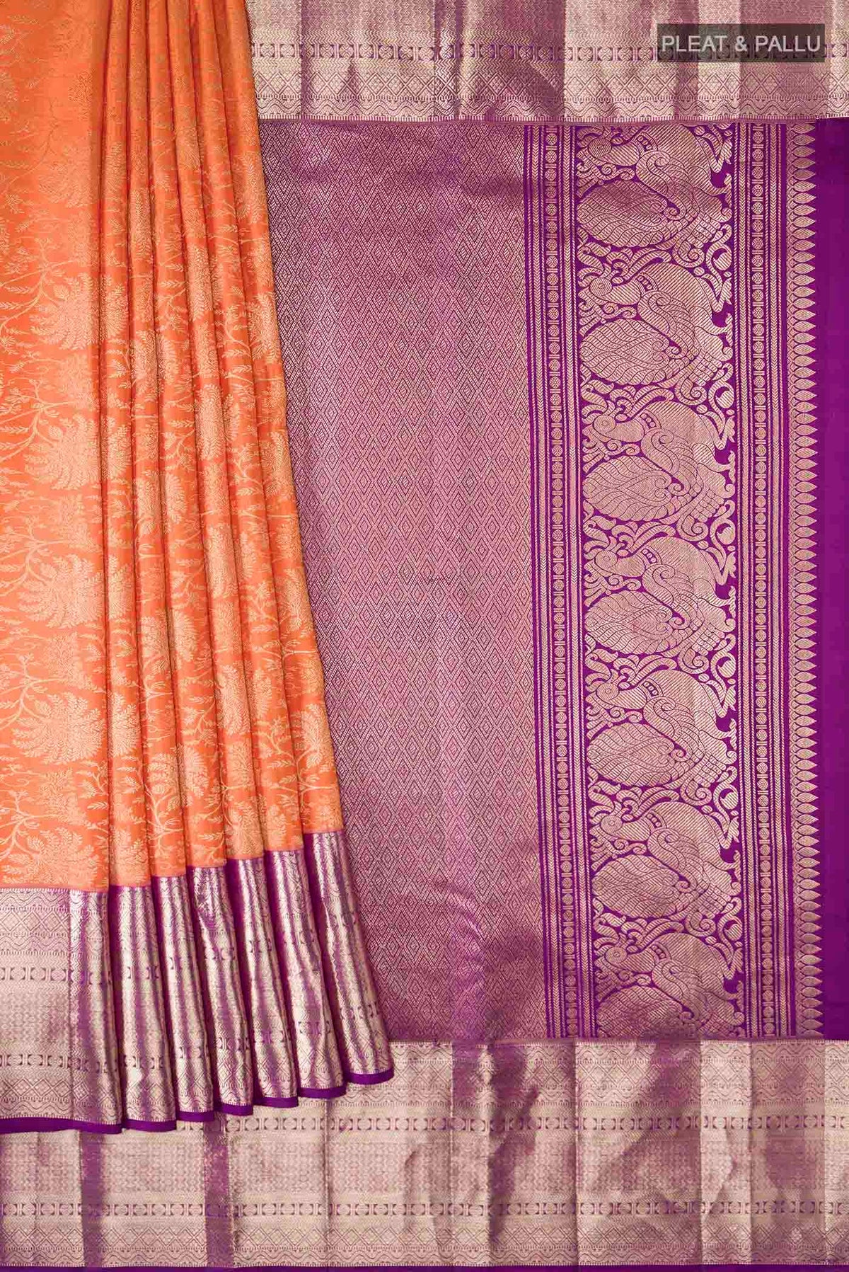 Pleats and pallu of Orange Kanchipuram Silk Saree with Zari Brocade on the body and Zari Border