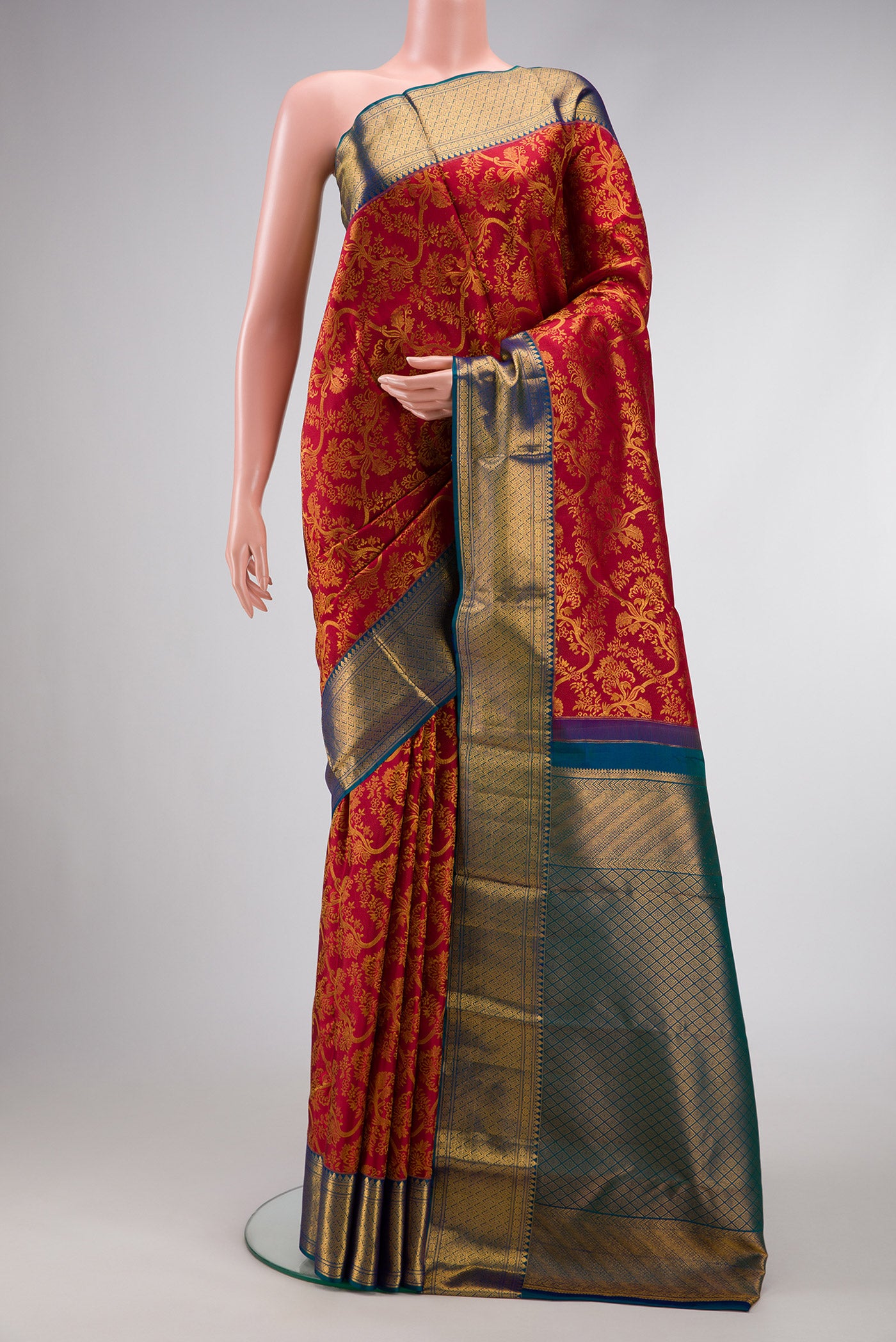 Maroon Dual Tone Kanchipuram Silk Saree with Zari Brocade on the body and Zari Border.  displayed on a mannequin