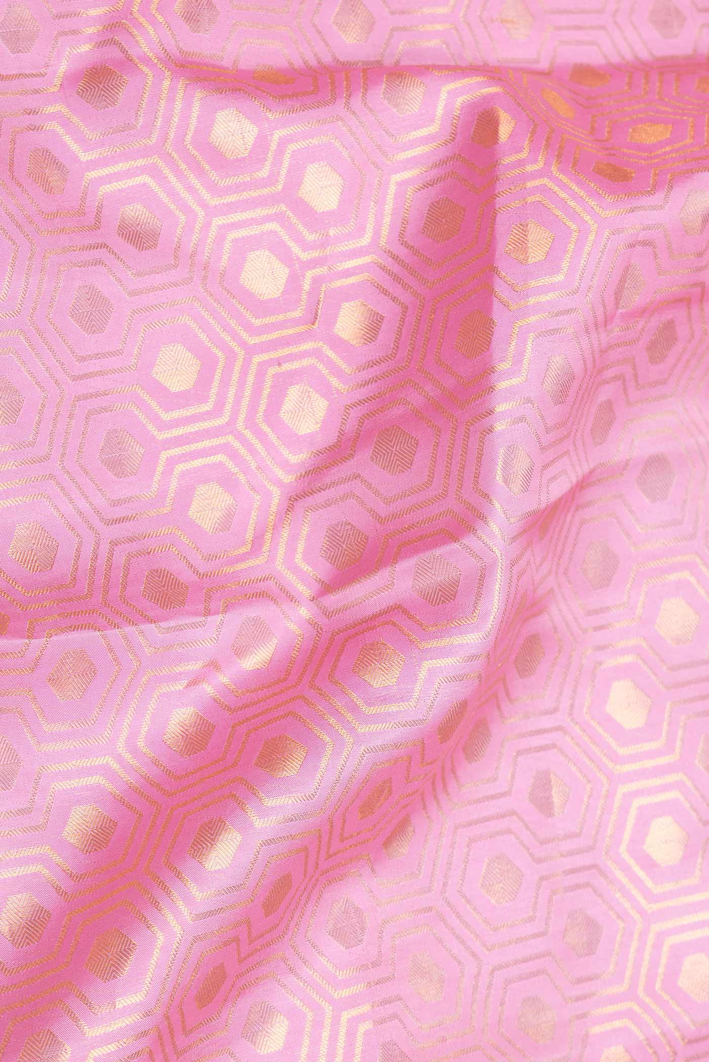 Close up of Pink Dual Tone Kanchipuram Saree with Zari Brocade on the body and Zari Border displaying folds